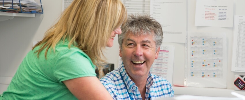 Administrative staff member talking with a Consultant.