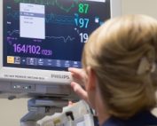 Nurse looking at heart monitor