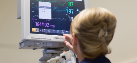 Nurse looking at heart monitor