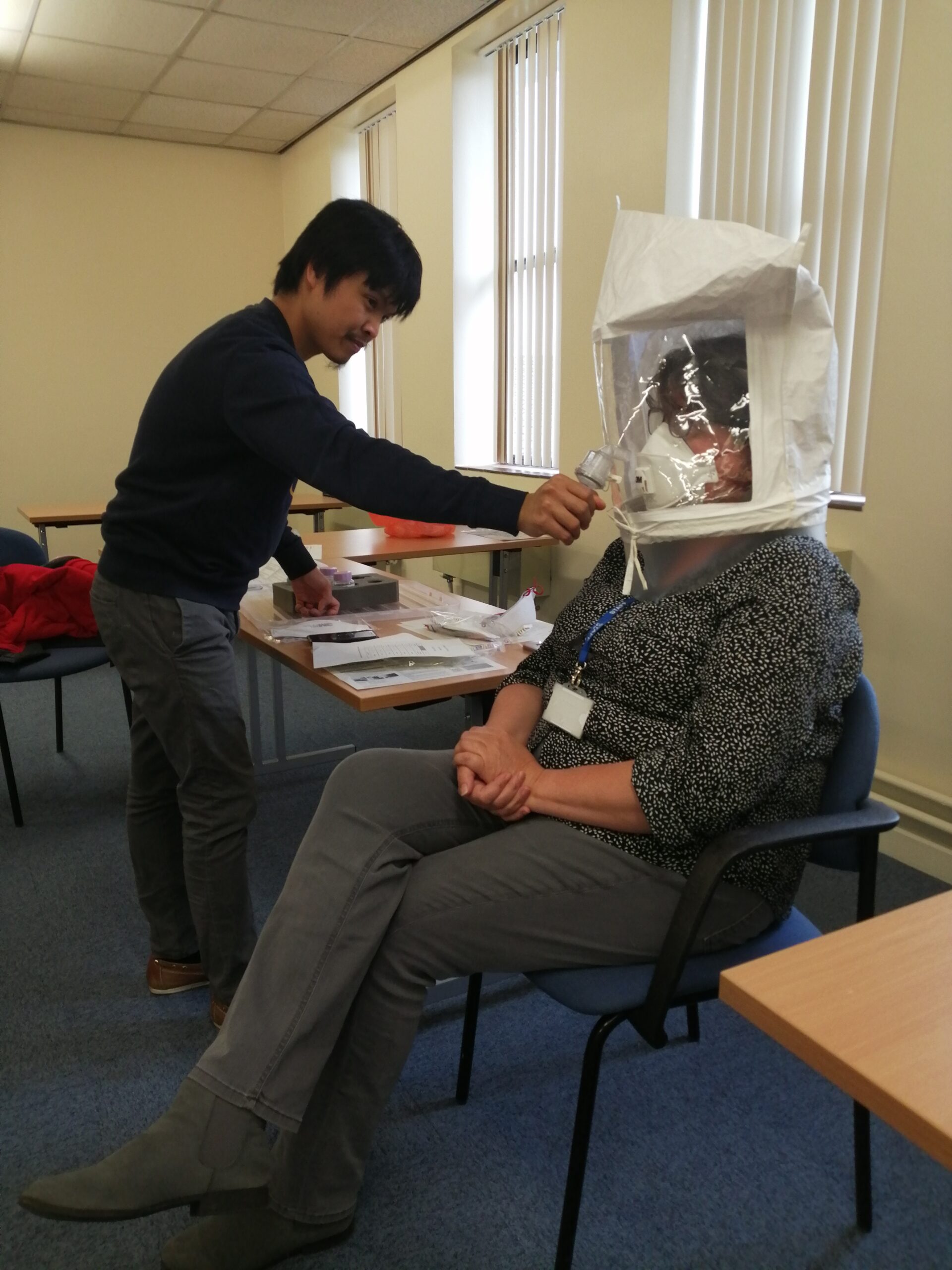 SaTH training external healthcare professionals on how to fit face