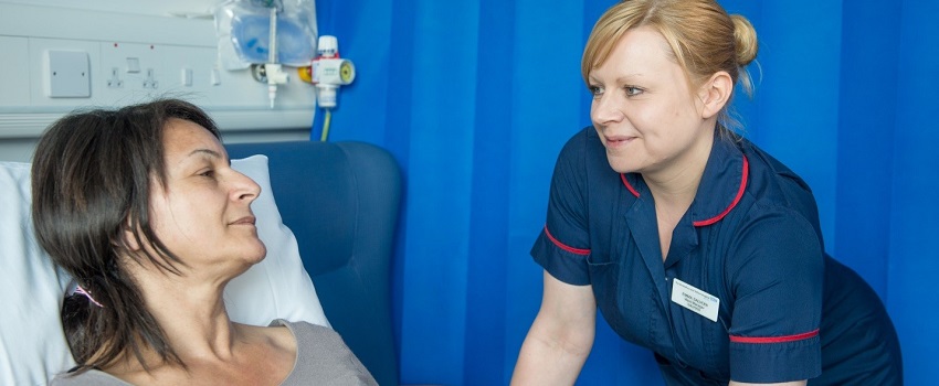 A nurse attending to a patient