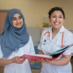 Two nurses looking at a file