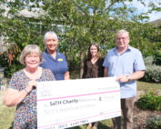 Former patient Jonathan Mills and his wife Ann present £750 cheque to the Colorectal Department - Julie Powell and Kirsten McArdle