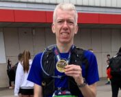 Robert Wright holding his medal