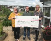 Ernest and Hannah Morris holding the big SaTH Charity Cheque