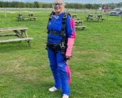 An image of Dementia Nurse Karen Breese preparing for her paracute jump