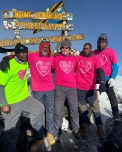 Nigel Lee wearing his SaTH Charity T-shirt at the peak