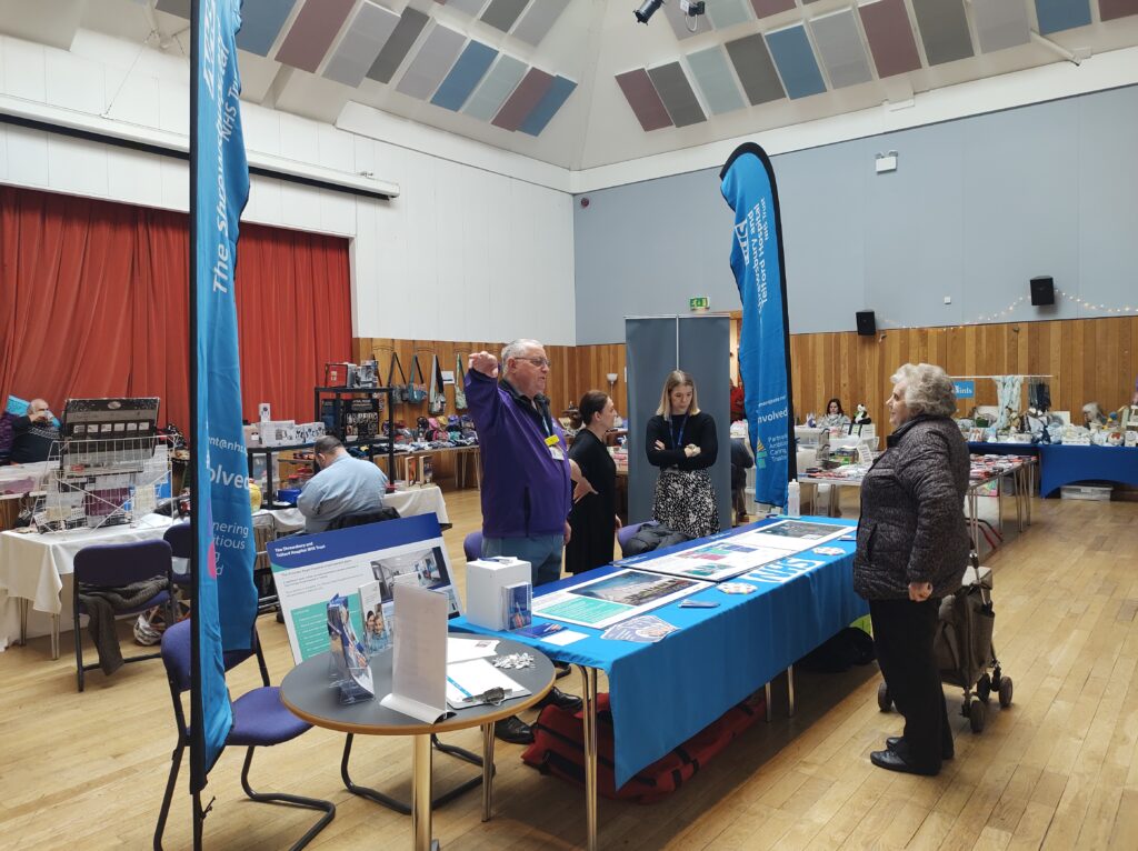 Members of the public meet and talk to hospital colleagues.