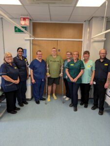 Neil Jones, pictured with staff and his surgeon Mr Ralph Perkins