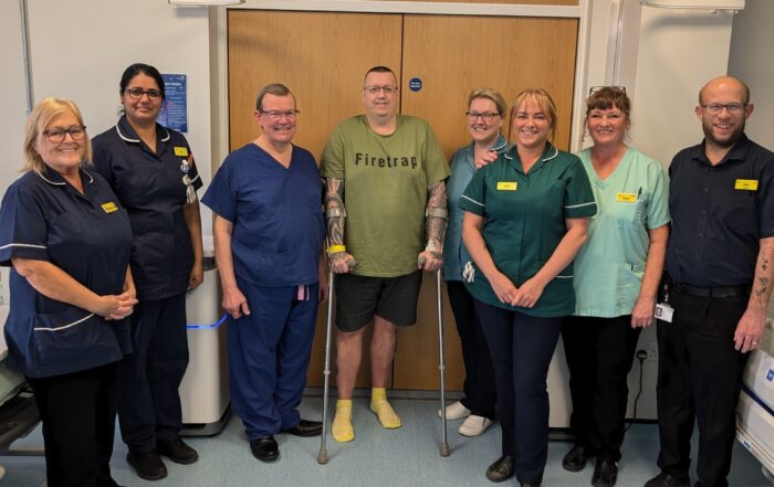 Neil Jones, pictured with staff and his surgeon Mr Ralph Perkins