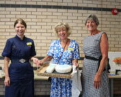Jules Lewis, Julia Clarke and Jules Lock with the cake.