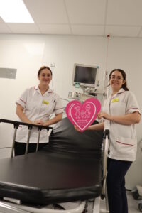 Cardiology staff stood next to the stretcher