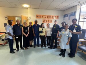 Maureen Drakeley with her surgeon and the rest of the team