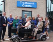 People on hospital transport buggy