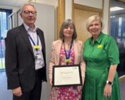 Angela receiving her award from Andrew Morgan, Chair at SaTH, and Jo Williams, Chief Executive at SaTH