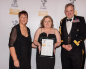 Commodore Tristram Kirkwood presents Sarah Millington and Lisa Walker with the Gold award