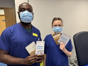 Enoch Mantey and Claire Atherton with the Achiles tool