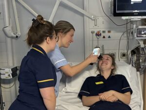 An image of Staff Demonstrating the Pupilometer