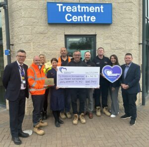 Matthew Neal and Jules Lewis are pictured with SaTH colleagues and representatives from Vital Energi marking the cheque presentation